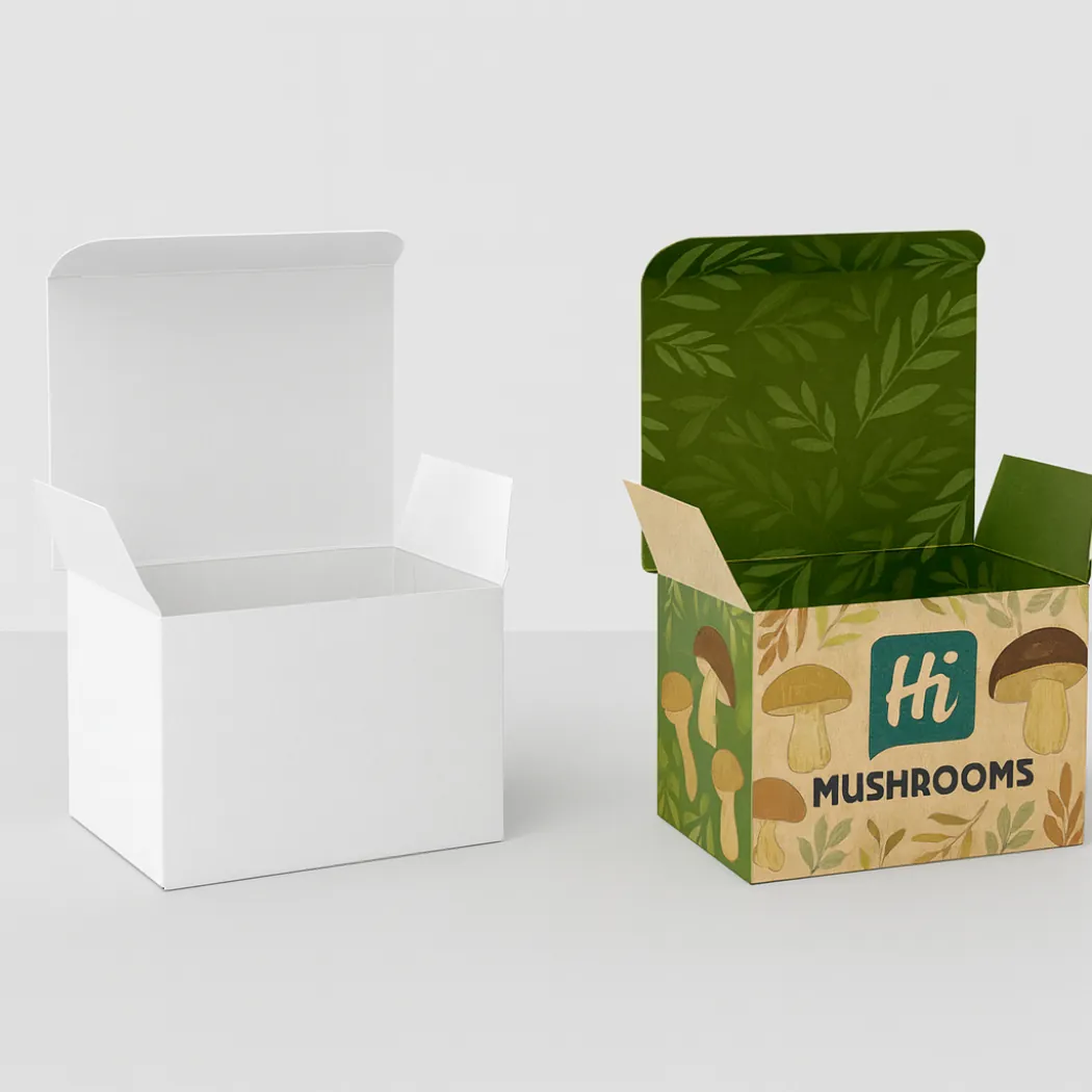 Two open rectangular boxes- one plain white and one with earthy mushroom and leaf illustrations- class=